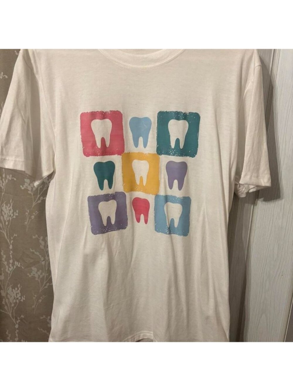 White tee with colorful tooth graphics in squares #graphic #tooth